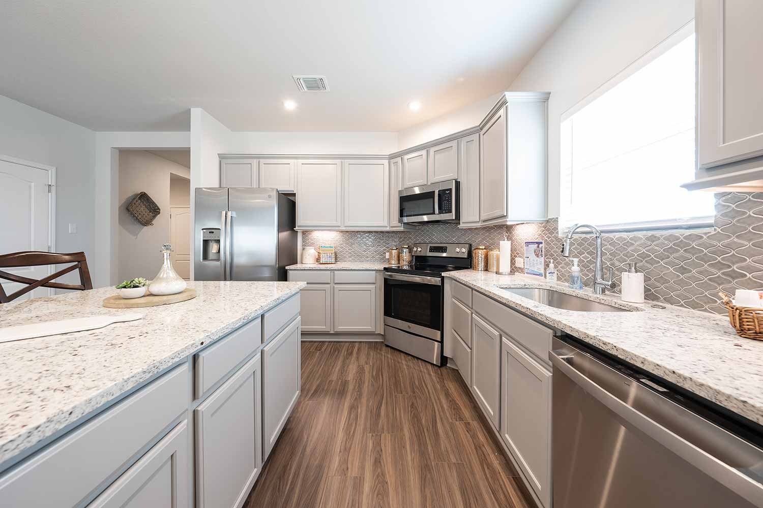 Omega Builders Model Home Stock Image https://www.omegabuilders.com/hubfs/content/photos/oak-ridge-model-home/808-coriander-015.jpg