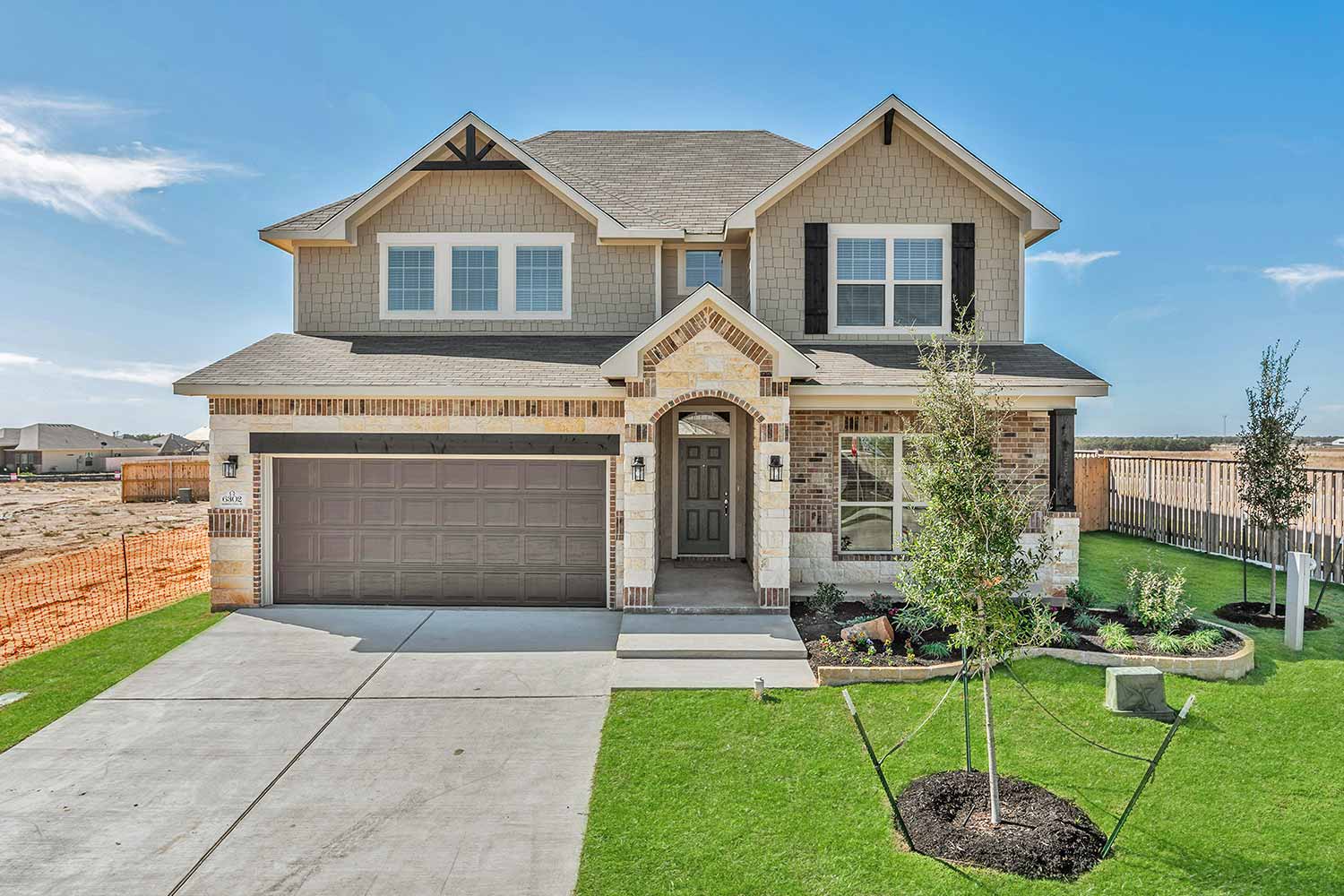 Exterior of two story home for sale in Texas built by Omega Builders