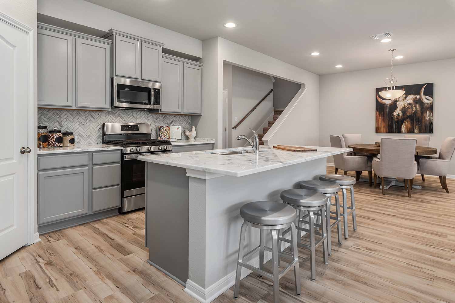 Kitchen with large island in Texas model home